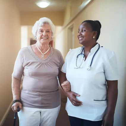 Nurse supporting elderly patient