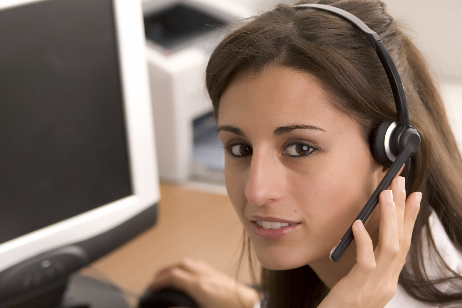 Female DSE user wearing a telephone headset