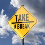 Sign post with caption "take a break"